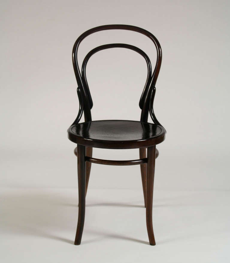 Austria, c. 1900
Side Chair, Model No. 14
Designed by Michael Thonet in 1870
Made by Thonet Brothers
Stamped on bottom of frame
Bent dark walnut stained beechwood

Thonet Brothers made their debut in the coffeehouse world with chair No. 14,