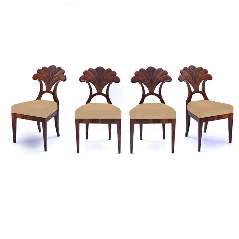 A set of four stunning Biedermeier side chairs from the Josef Danhauser workshop. The back features a palmette, a classic design motif that mimics a palm tree. The palmette is seen in classical styles, especially in the Biedermeier Neoclassical