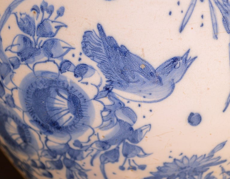 Inspired by Chinese blue and white porcelain of the Ming dynasty, the decoration on the present vase is distinguished by its large scale, the richness of the flowers, the delicacy of the shading, the whimsical dragonflies, butterflies and birds. The