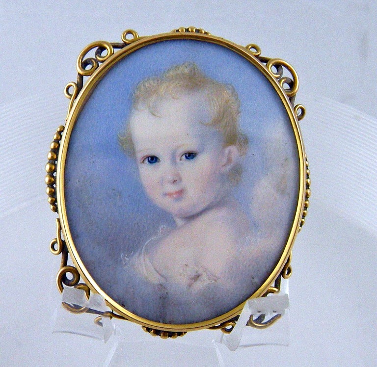 A beautifully painted posthumous portrait of a young child in gold locket designed originally to be a bracelet. 

Reference:

The late eighteenth-century emergence of the modern family opened 
a new era in the history of children. Once viewed
