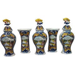 A Fine Dutch Delft Five Piece Garniture of Vases & Covers.