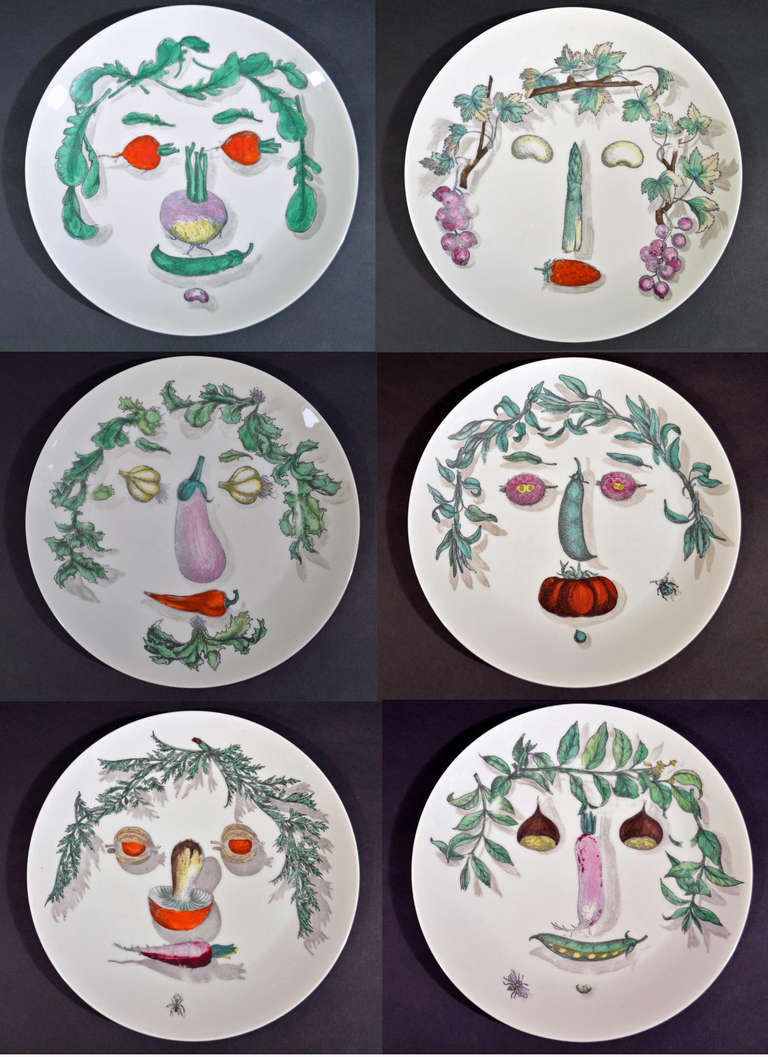The plates are from a set of twelve after Arcimboldo-the design of a face created with the use of vegetables. 
The plates are numbered 3, 7, 8, 10, 11 & 12

Reference: Fornasetti: The Complete Universe, Barnaba Fornasetti, Illustrated: p 616,