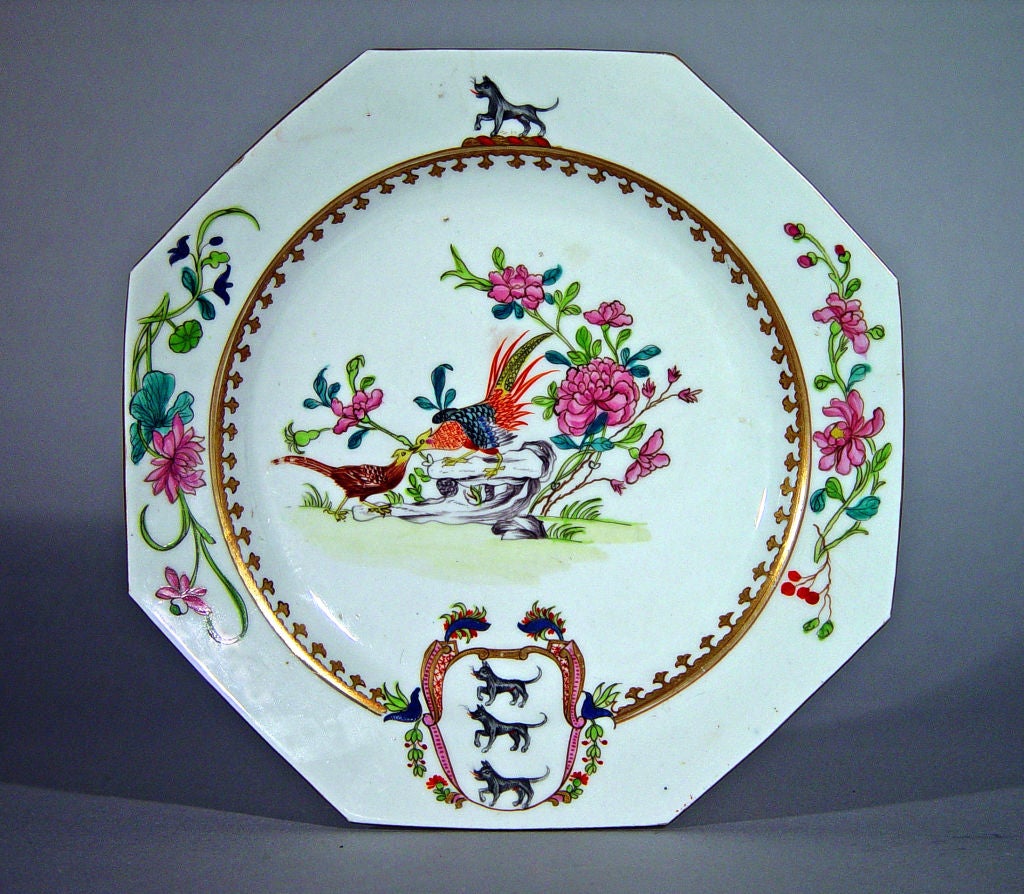 Possibly Coalport,<br />
<br />
The plates were made for the Lovett family.  They are in a style originally made in 1735-40 in Chinese Export Porcelain with an octagonal silver form , the central well with famille rose depictions of exotic birds