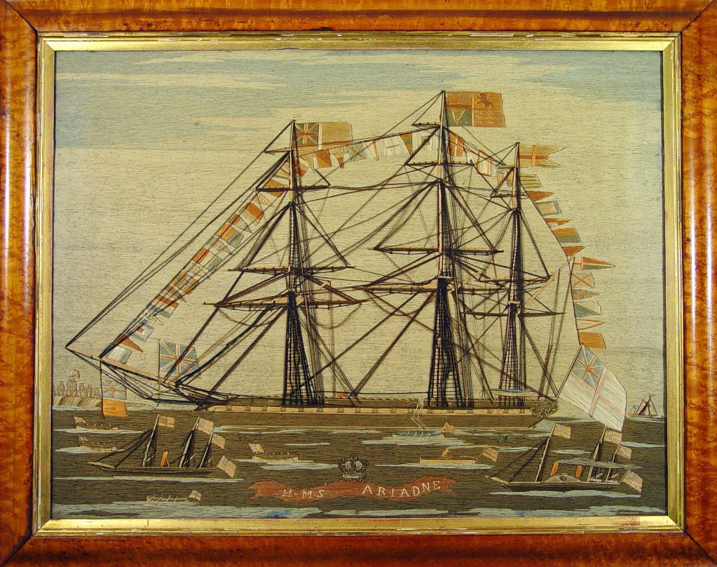 The large woolie depicts a starboard side view of a British Royal Navy Frigate Fully dressed and at anchor with a Union Jack on the bow and the Royal Standard on the Main mast.  Various other ships are depicted- long boats, steam yachts and possibly
