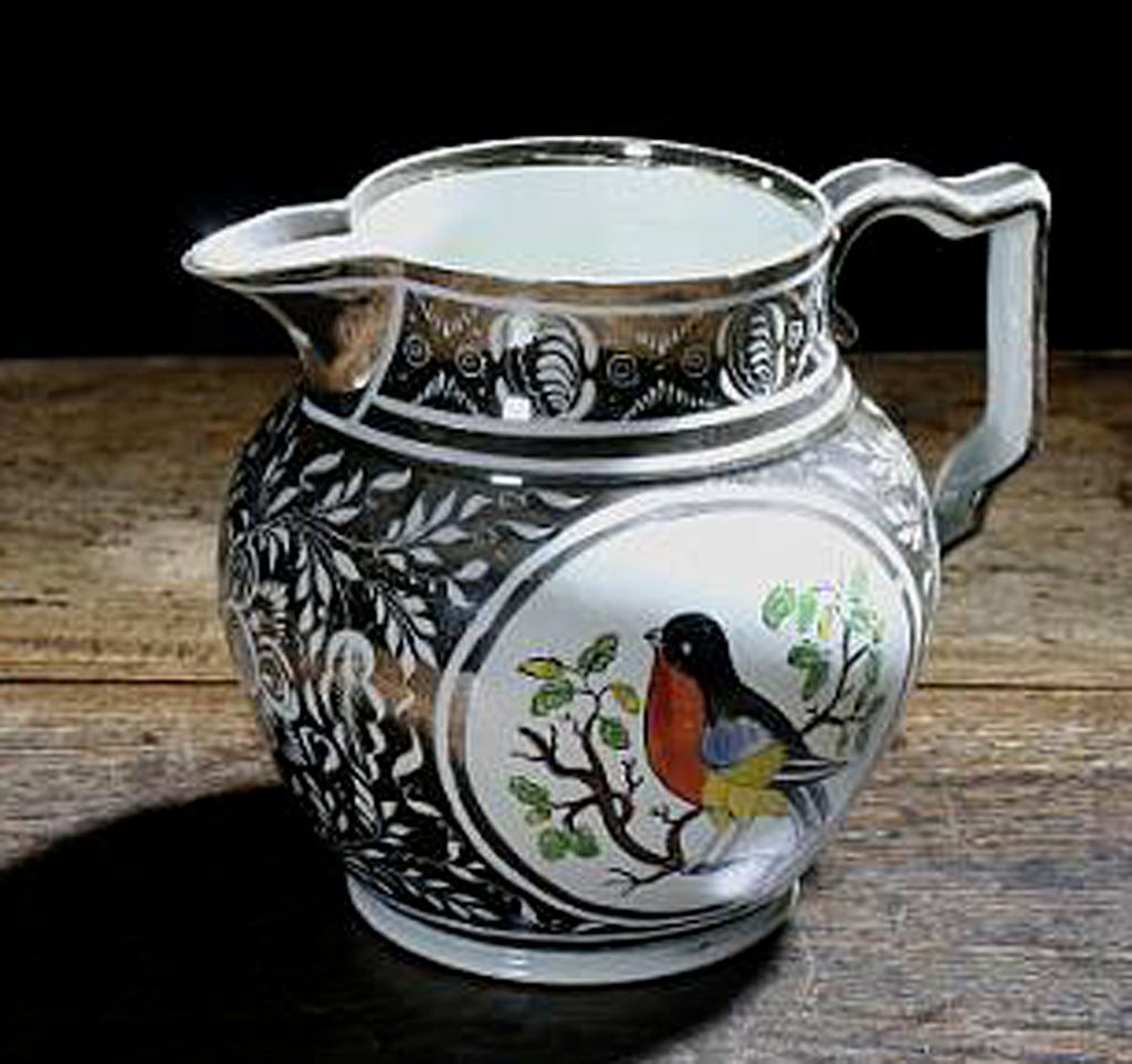 An English Silver Lustre Jug decorated with a Robin