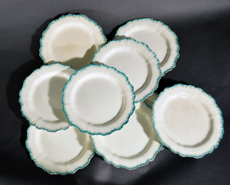 Moulded creamware plates with green shell edges.

Mark: Some with Impressed WEDGWOOD mark