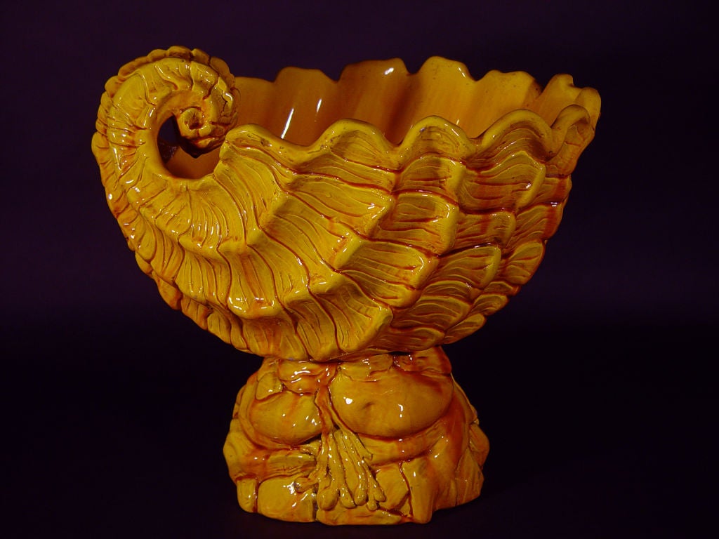 The large seashell frorm jardiniere is decorated in the majolica glaze colour known as lemon yellow<br />
<br />
Reference:<br />
<br />
Burmantofts was established by Wilcock & Company in Leeds and ran between about 1880 and 1904.  See