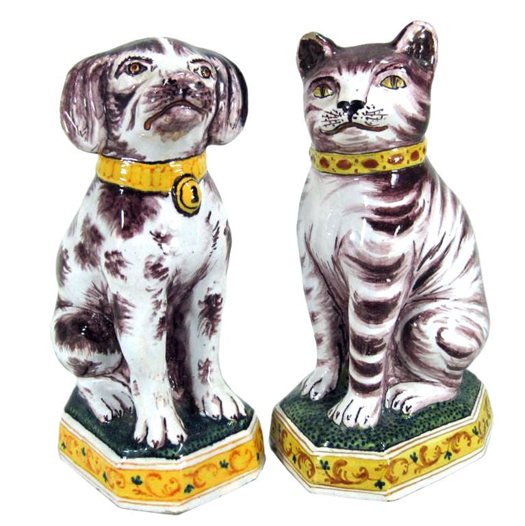 A Pair of Dutch Tin-glazed Earthenware Models of a Dog & Cat