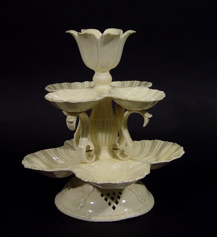 Yorkshire or Staffordshire,<br />
<br />
<br />
The striking and unusual sweetmeat or Grand Platt has two tiers of conjoined scallop-shells, the higher and smaller set supported on three S-shaped supports and a central fluted baluster column