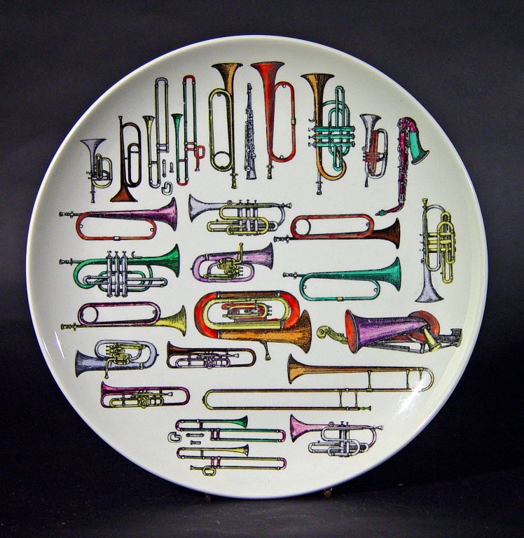 The large plate depicts a wide variety of wind instruments.