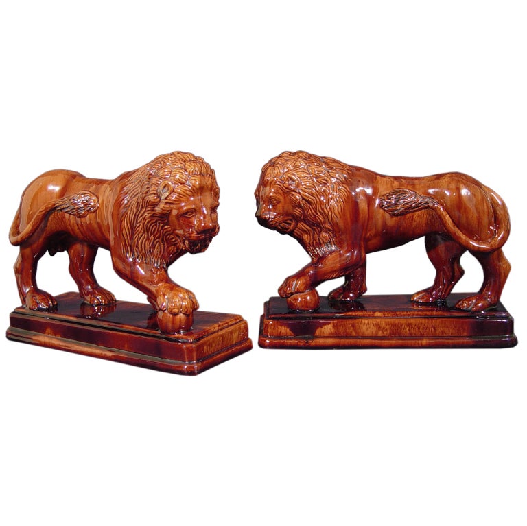 A Pair of Large Rockingham Pottery Lions