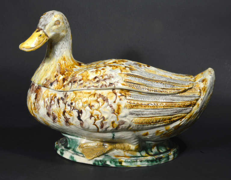 Early 19th century Portuguese creamware pottery life-sized duck tureen was made at the Royal China Works, Rato factory- Fabrica do Rato. It is a stunning and incredibly rare life-sized model of a duck standing on a cream and green mottled hollow