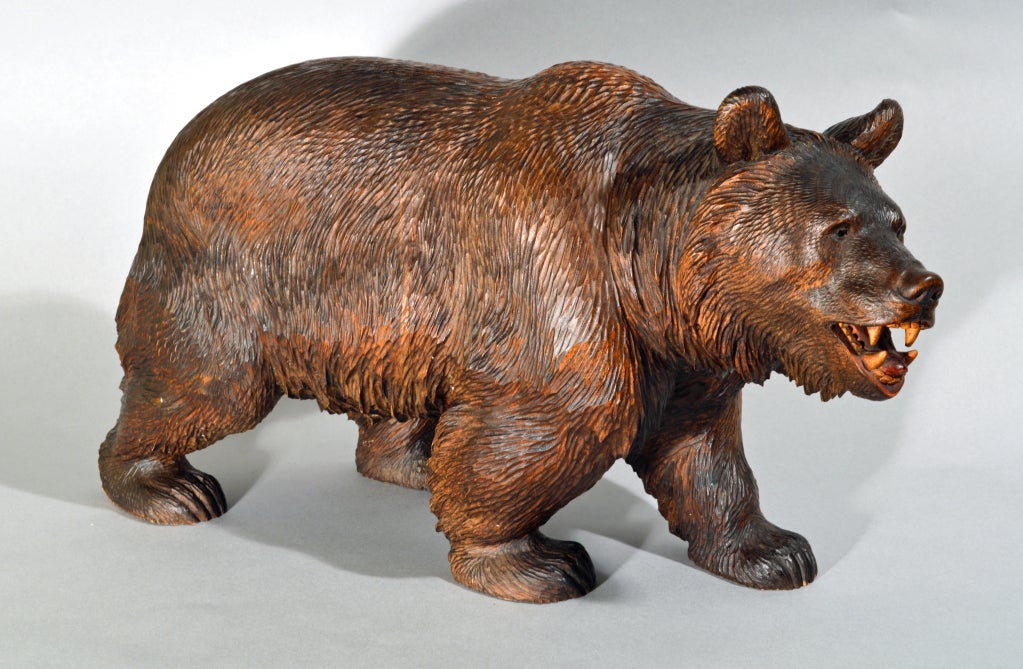 The fine carving depicts a brown bear walking on all fours, its head turned slightly to one side, his mouth open revealing teeth and tongue.  The colour of the patena is excellent as its the detailed carving.
