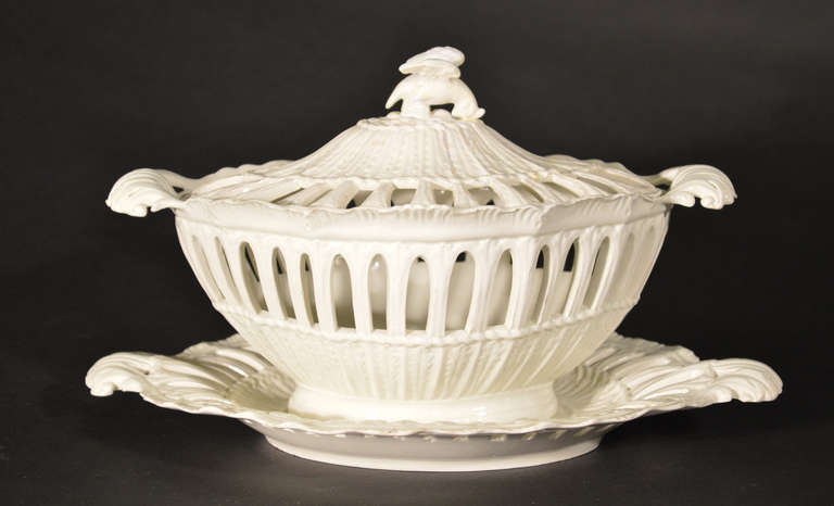 John T. Morton, Leeds,

Dimensions: Tureen: 11 1/4 inches x 7 inches x depth: 7 1/4 inches

The lovely creamware basket was made by one of the best of the 20th century makers, John T. Morton at Leeds.  Morton made the finest pieces for