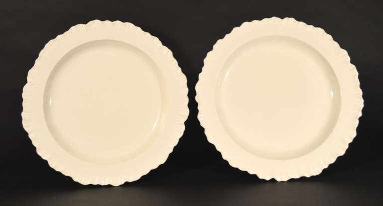 The plates in plain creamware with shell-edged moulded borders.<br />
<br />
Marks: Impressed wedgwood and one with impressed 10, the other B & 7.