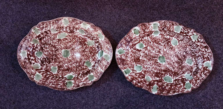 A remarkable pair of two massive moulded Whieldon type dishes with a tortoiseshell and green sponged decoration.