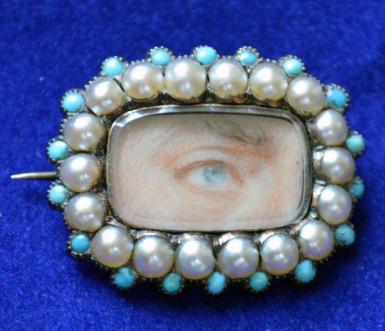 The well painted man's eye is within a period broach of silver with a turquoise and pearl surround. 

Provenance: 
Private American Collection,
with D S Lavender Antiques Ltd.

In the 1780's, when George, Prince of Wales, heir to the throne of