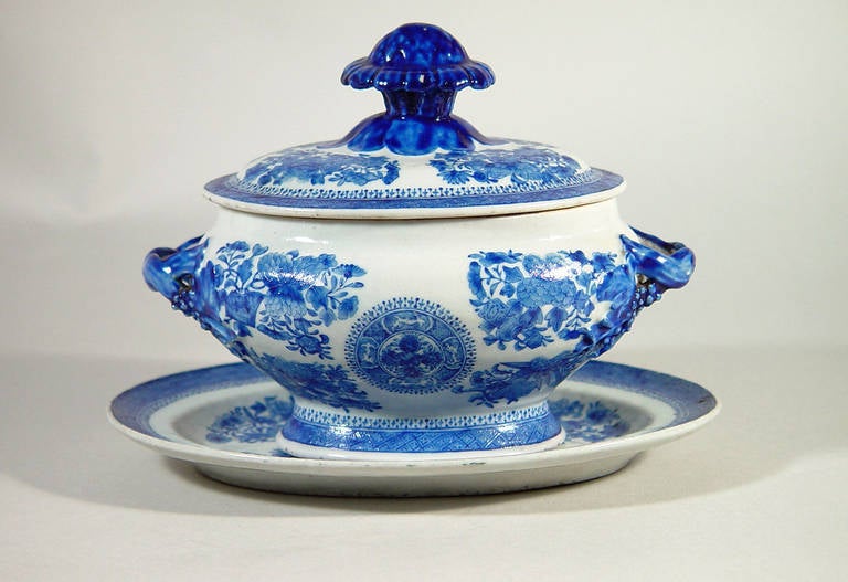 The Chinese porcelain blue enamel tureen is of an oval footed form with a dark blue floral knop and strap handles. 

The tureen, cover and stand are decorated in the Fitzhugh pattern but rather than in common underglaze blue, this tureen is in a