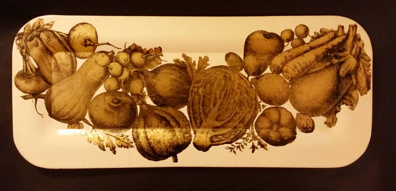 A wonderful early metal tray from the 1950s printed with vegetables in gold on a cream ground.