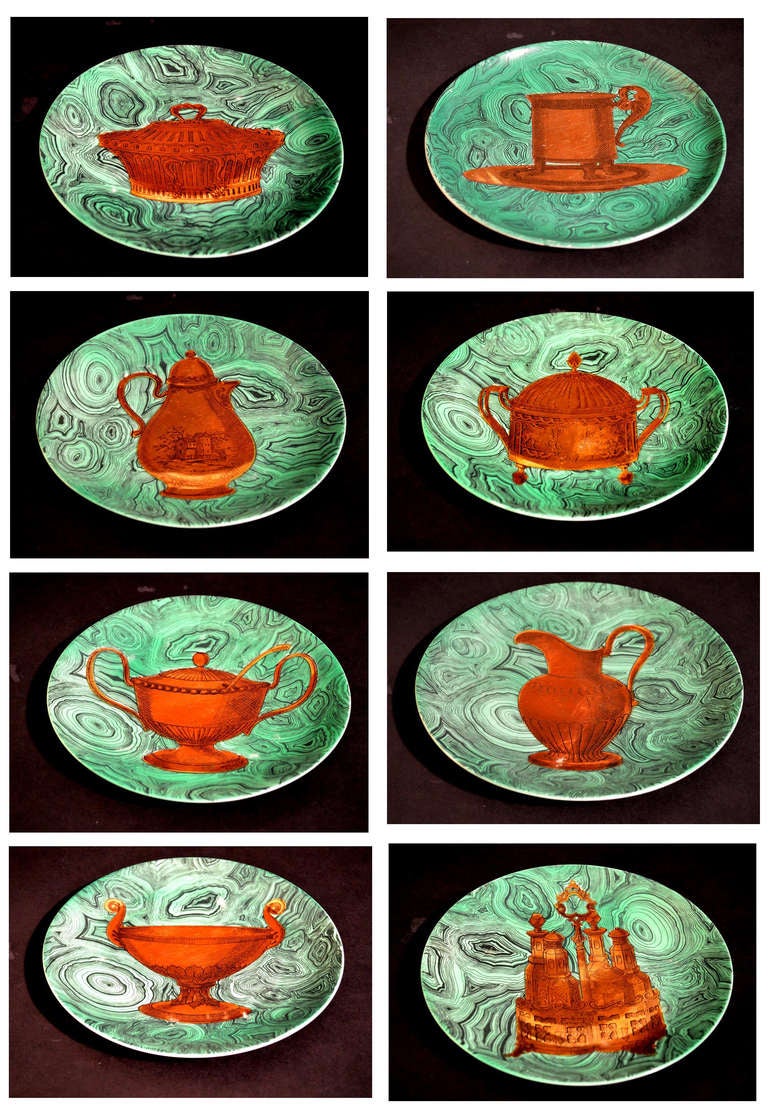 Stoviglie Pattern,  

The circular plates are each painted in gilt with a different painting of table accessories on a malachite ground The subjects are a water jug (#8), A soup tureen (#1), a cruet (#6), a footed domed tureen (#5), a footed tazza
