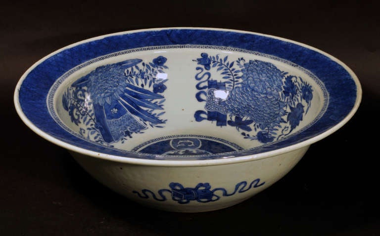 The large basin is fully decorated on the interior with a Blue Fitzhugh design.  The exterior with four different Buddhist Precious Objects wrapped with ribbon.