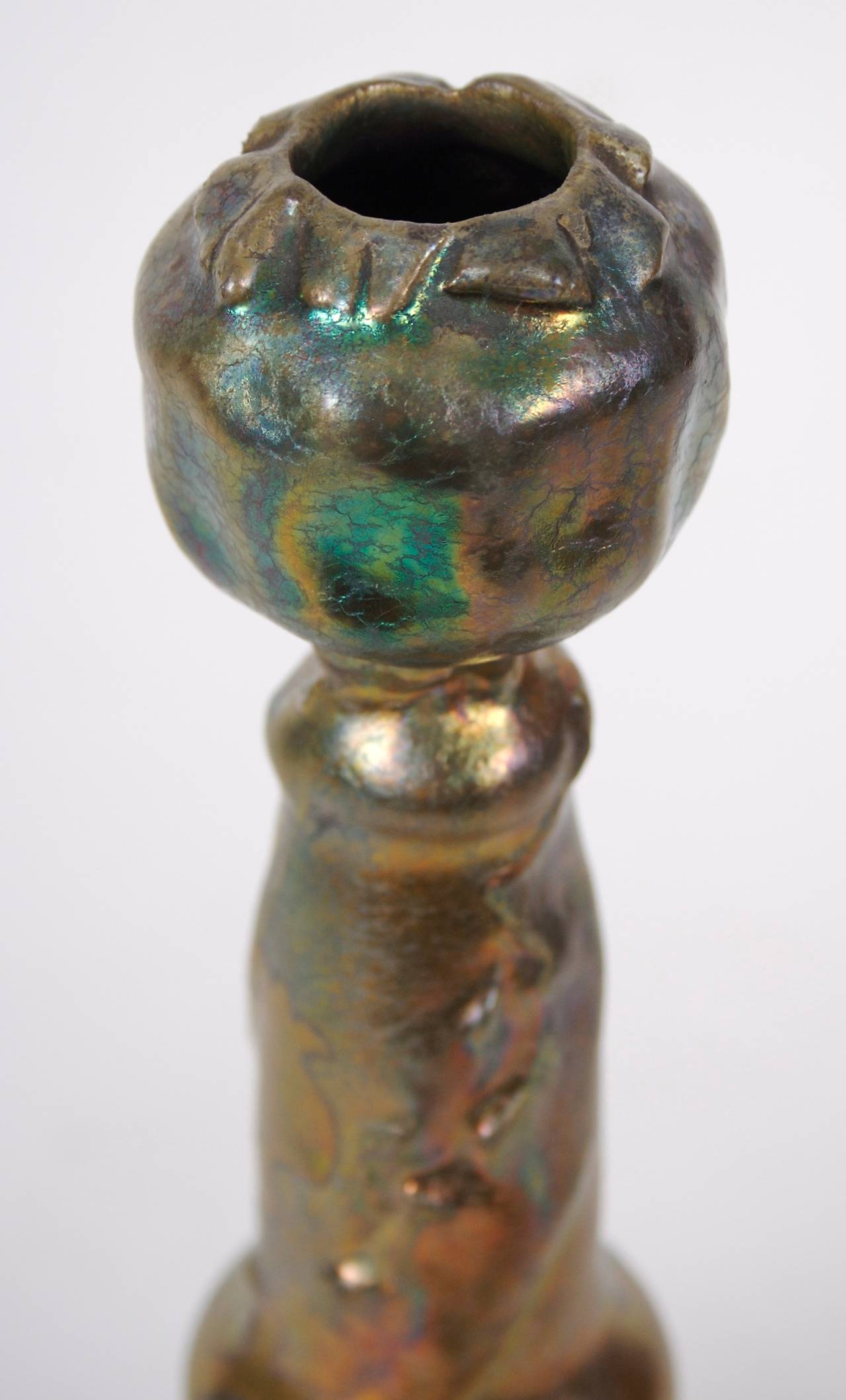 Wonderful color and iridescence in this French Art Nouveau period ceramic vase by Frederic Danton, c. 1905. 

Danton (1874-1932) was born in Aubusson France, where he was employed at the Aubusson factory as a textile designer. He founded a small