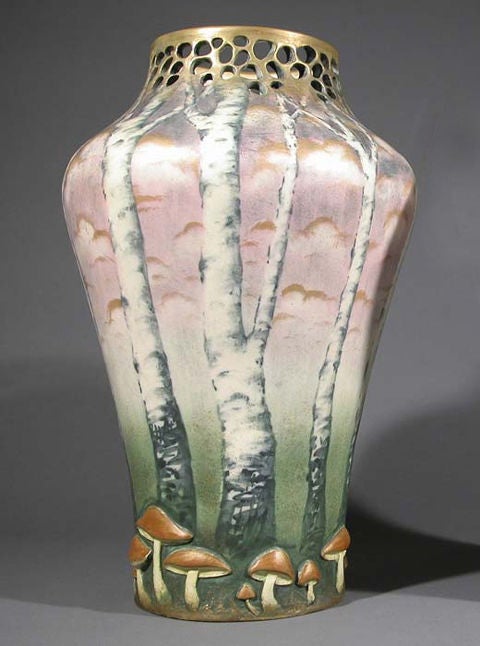 Austrian Art Nouveau period ceramic vase by Paul Dachsel, circa 1906-1910. Forest motif with bas relief mushrooms and cut-out detail. Matte gold drawing and sponging.

Dachsel was one of the principal artists connected with the Amphora Company in