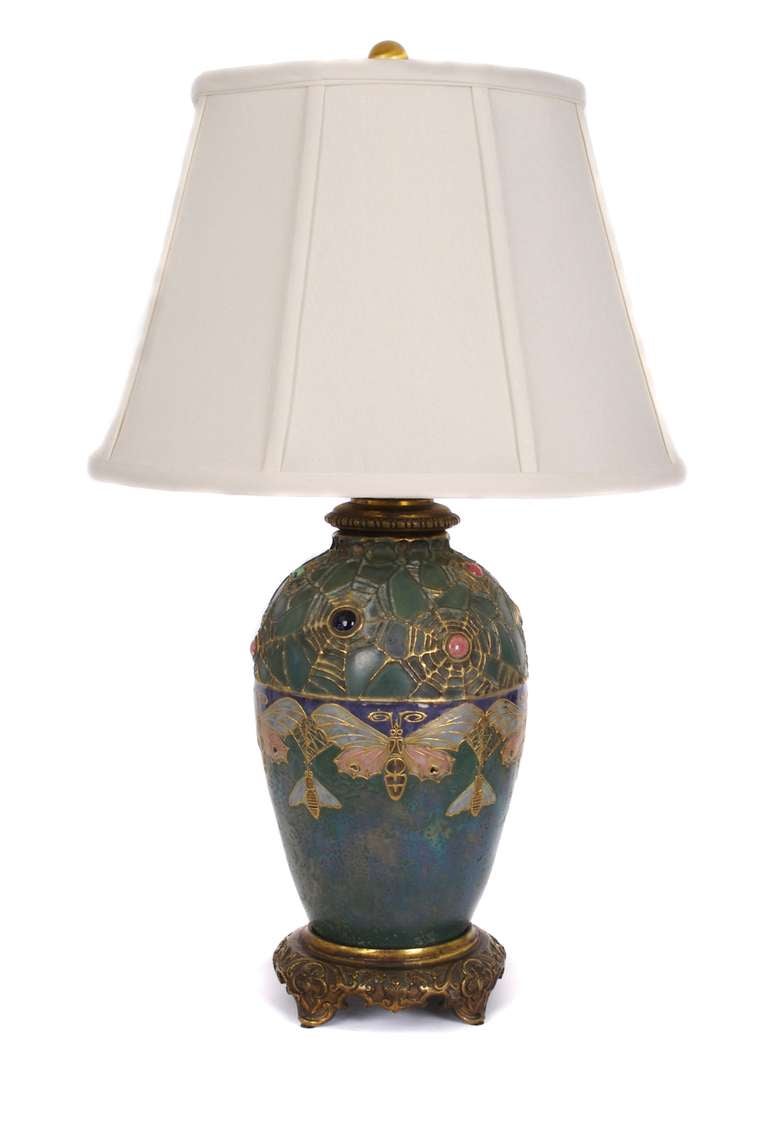 Austrian Art Nouveau period Amphora vase converted to table lamp. From the Amphora "gres-bijoux" series, soft stoneware decorated with carefully detailed butterflies, owlet moths, spiderwebs and colored stones. Metal mount. Reference: