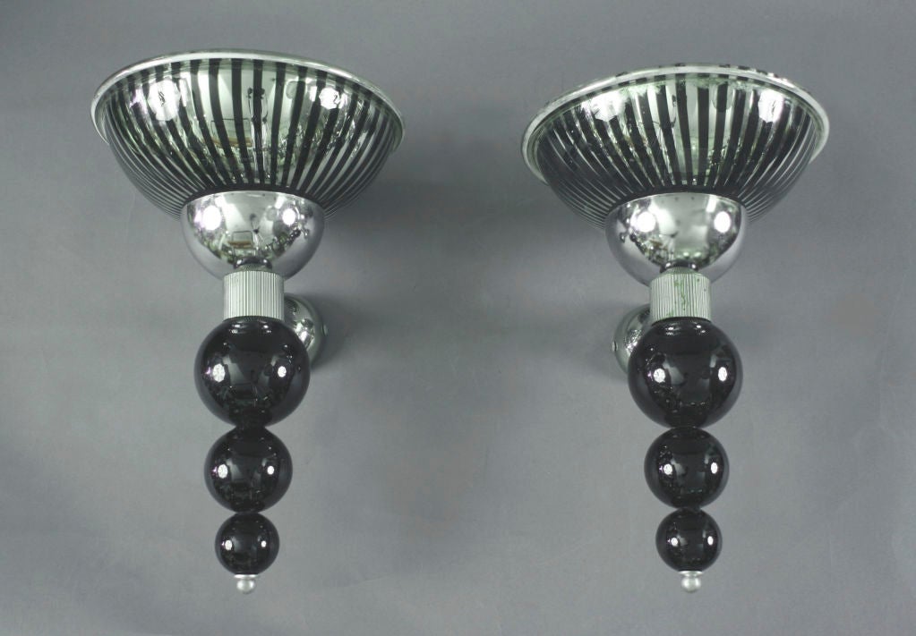 Pair of Italian silvered and black glass sconces by Aureliano Toso, circa 1970s.

Vetreria Aureliano Toso was founded in 1938 and is recognized as being one of the greatest Murano glass manufactories. Gio Ponti became artistic director of the firm