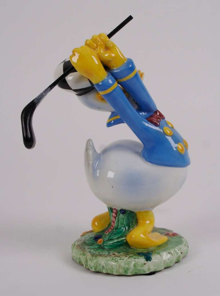 "Donald Duck Golfing," a ceramic Disney character created by the "Societa Anonima Ceramiche Zaccagnini," in Florence, Italy, c. 1940. In 1938 Urbano Zaccagnini negotiated a coveted licensing agreement with Walt Disney. That same