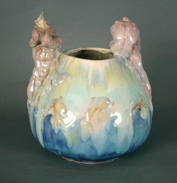 Stylized ceramic vase by Edgardo Simone (1890-1948), circa 1940s. Neptune and water nymph depicted in high relief. Classically trained, Simone worked in New York, Chicago and California after immigrating from his native Italy. His work demonstrates