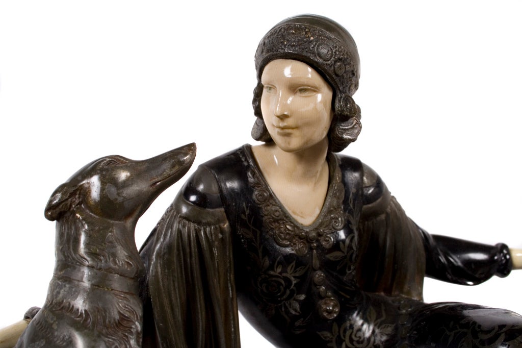 French art deco period sculpture by Menneville, c. 1920. Spelter and ivorine on Marble base. Marked Menneville on right front of marble.