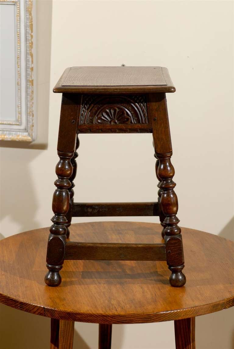 Lovely English Oak joint stool with quarter sawn smooth top with hand turned legs.  The are slightly splayed and and has a stretcher rail.  There are beautiful hand carved details in the apron.

Dimensions

Top
19.5h X 17.5w X 11.5d

Base