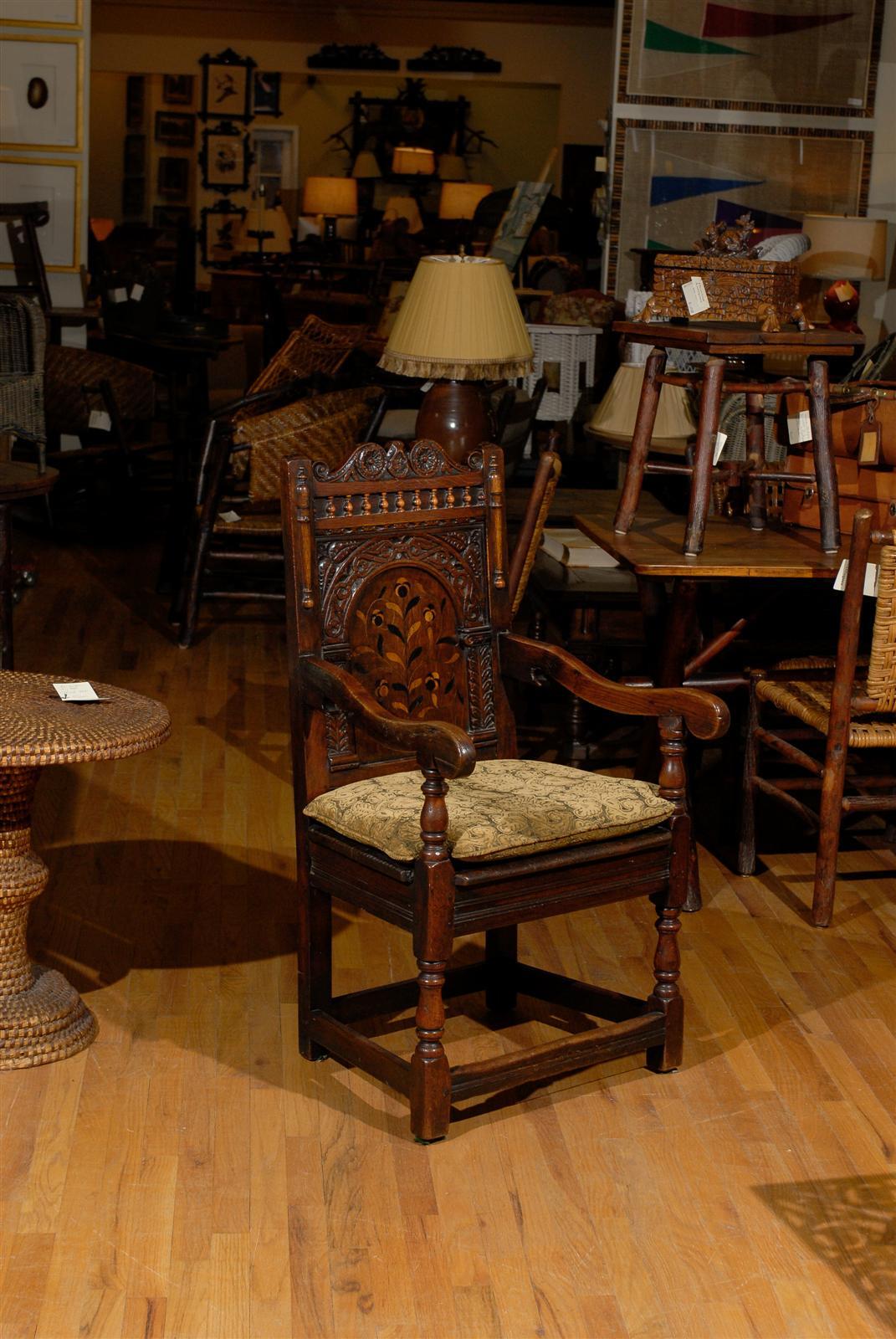 This is a marvelous example of 18th joined chair with an inlay of floral panels. The lovely floral patterns are very graceful and have a wonderful sense of style. This was probably made by a very skilled joiner and most likely in a large city with