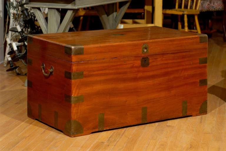 Lovely Camphor coffer in campaign style.  This is a wonderful trunk for the foot of a bed or it can be used as a coffee table.  The smell of camphor is still very much a part to this piece.