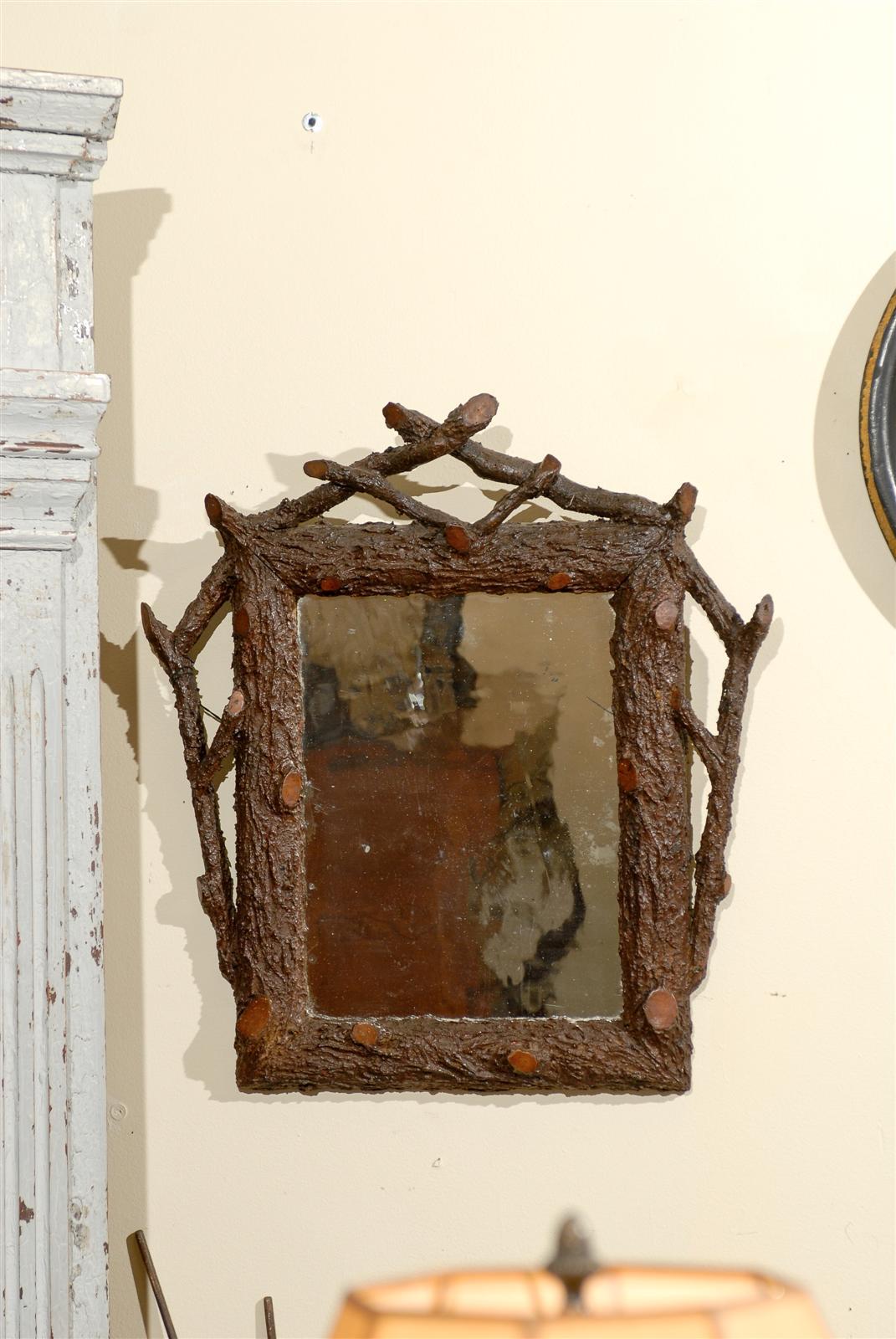 This is a wonderful example of an early Black Forest. It would look wonderful in any home. The mirror is original to the frame.