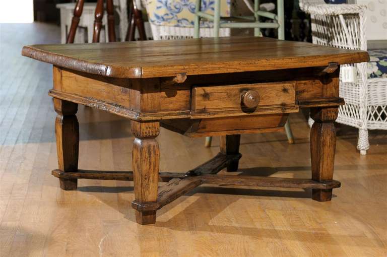 This coffee table was originally a Bavarian Pub table. We had it cut down to coffee table height retaining the original x-base.