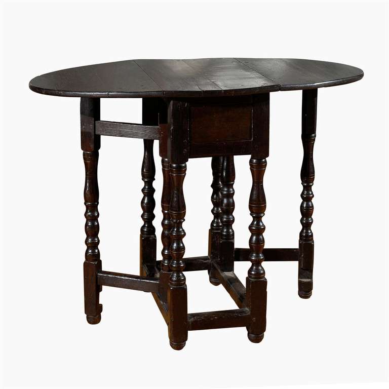A wonderful table of many uses. With the leaves down (13.25 in.) it would make a nice end table. With leaves up it could be a side table or even pull up a cute joint stool and use it for dining.
