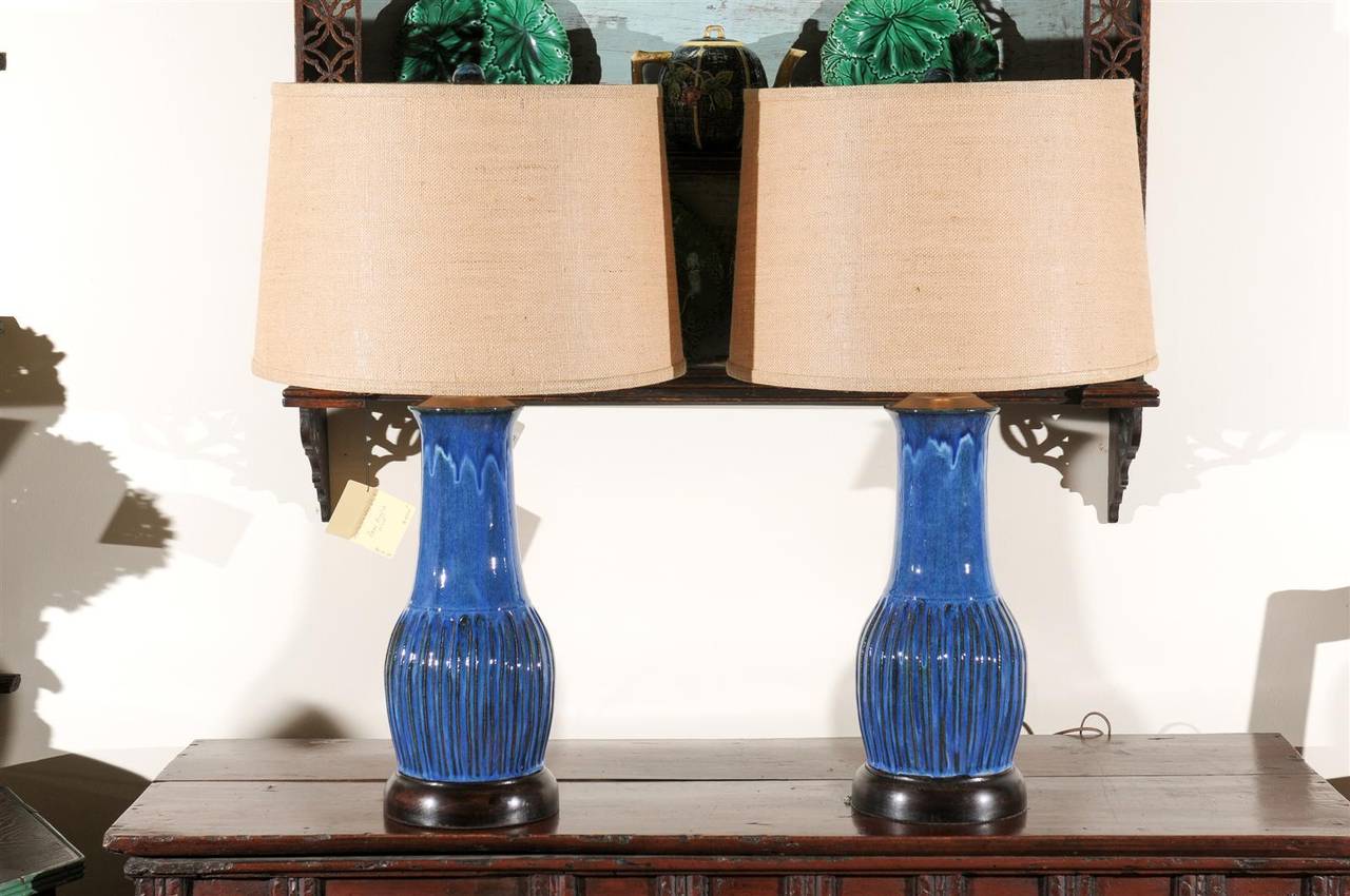 These are a beautiful pair of hand-thrown, hand-carved and glazed lamps made by a local north Georgia potter. These lamps would add a nice pop of color to any room and would go well with any decorating style. The lamps come with a matching glazed