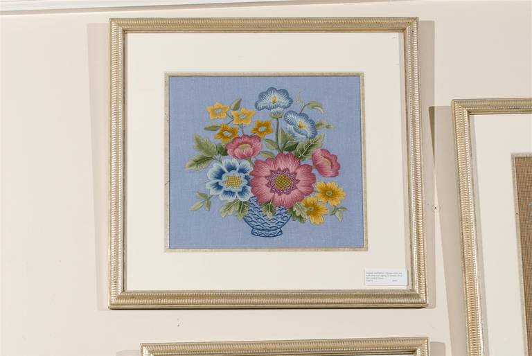This original piece of needlework of a flower arrangement in a bowl has been framed with an antique white mat with silver leaf edging. The frame is a 1 in. custom silver leaf combed frame.