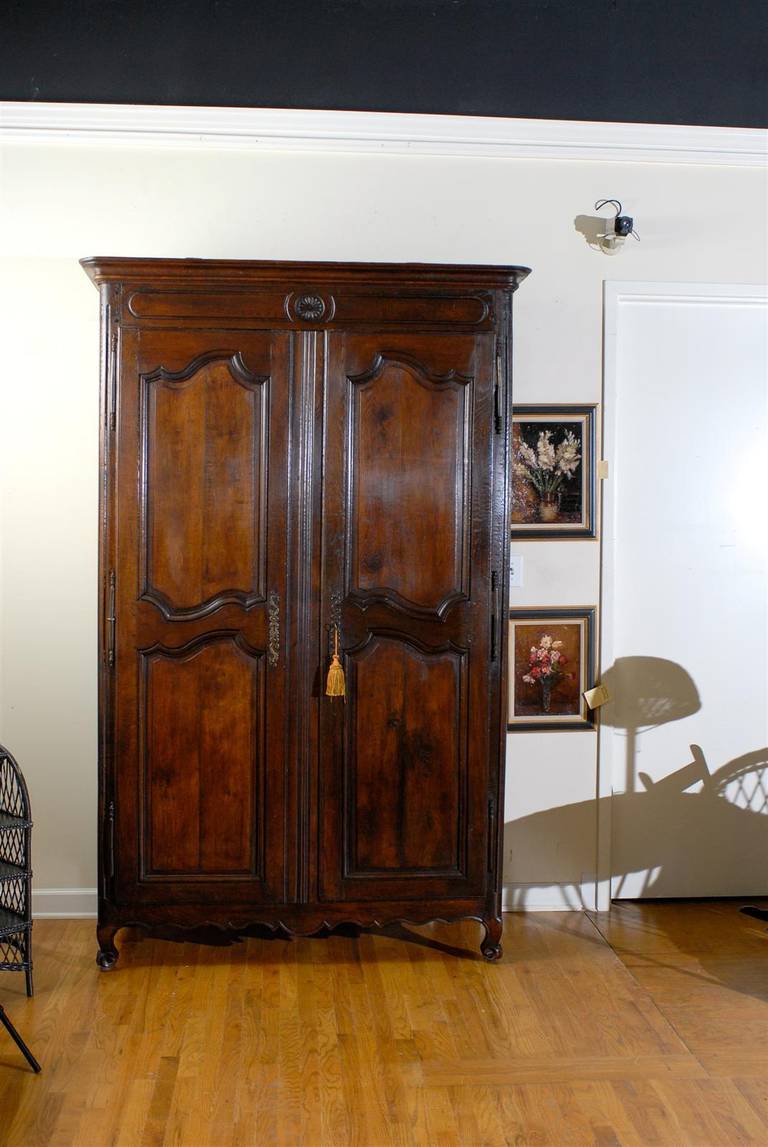 A fantastic 19th century oak armoire from Provence.  It has the lovely old iron hedges and escutcheons.  This would be wonderful in a mountain or city home.