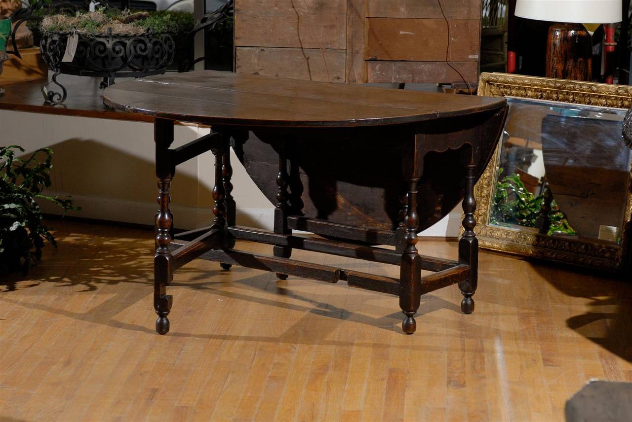 This is a wonderful and very useful gate leg table.  it could be used as a dining table, a centre table or behind a sofa.  The table has a lovely patina.