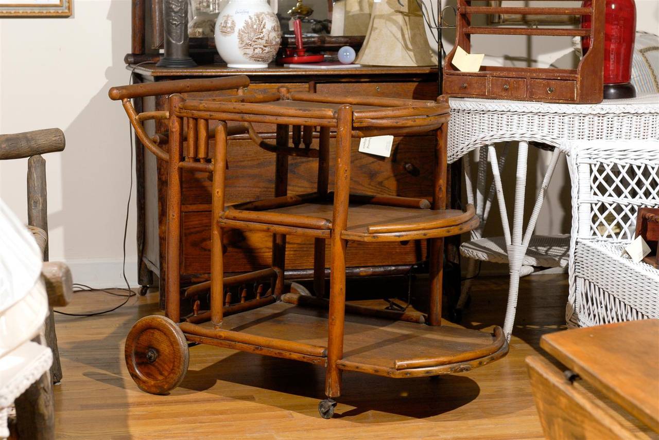 Old Hickory made these lovely tea carts in the 1920-1930s. This one is in wonderful condition. It would look very good in a mountain home or lake home. It has many functions. It can be used as a bar, teacart or a side table.