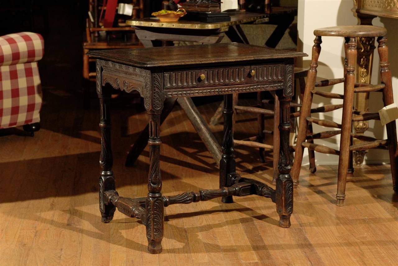 This is a wonderful example of a 18th c joined table.  The table was later enhanced with carving on the top and the legs.  The color is perfect and very warm.  The table is in excellent condition for it's age.