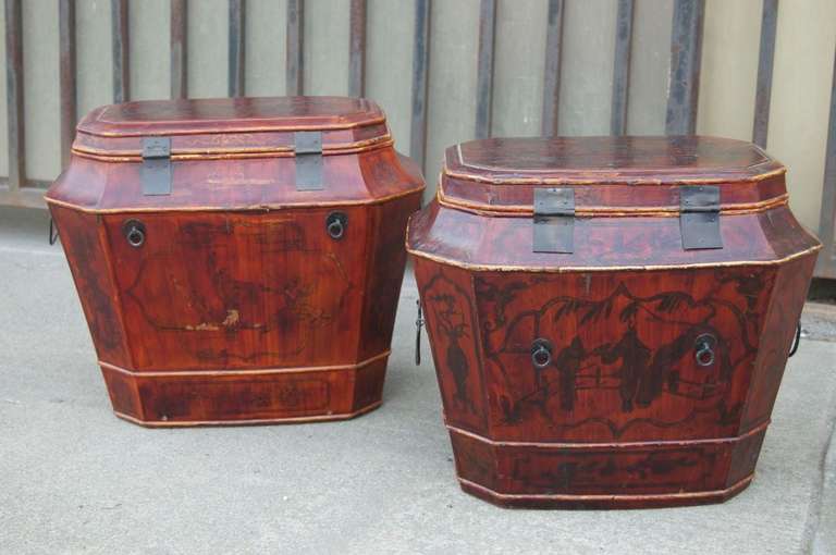 Pair of Chinese wood traveling trunks. Lacquered finish over painted designs with gold gilt detail. All original brass hardware.