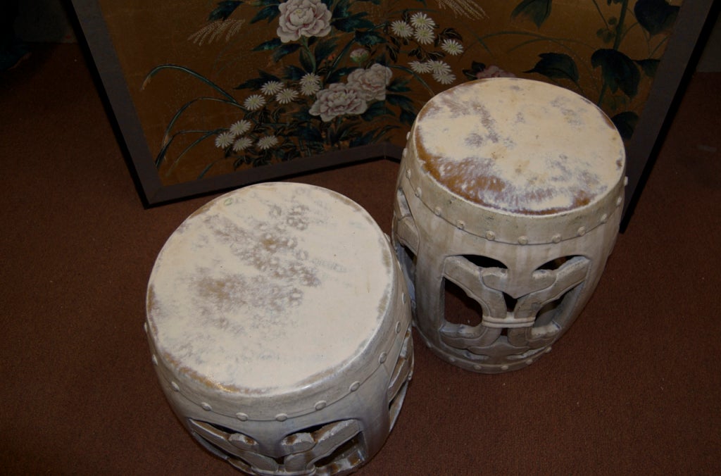soft ivory glaze over terra cotta ceramic form with intertwined rope motif. Top and bottom drum with raised nailhead detail.