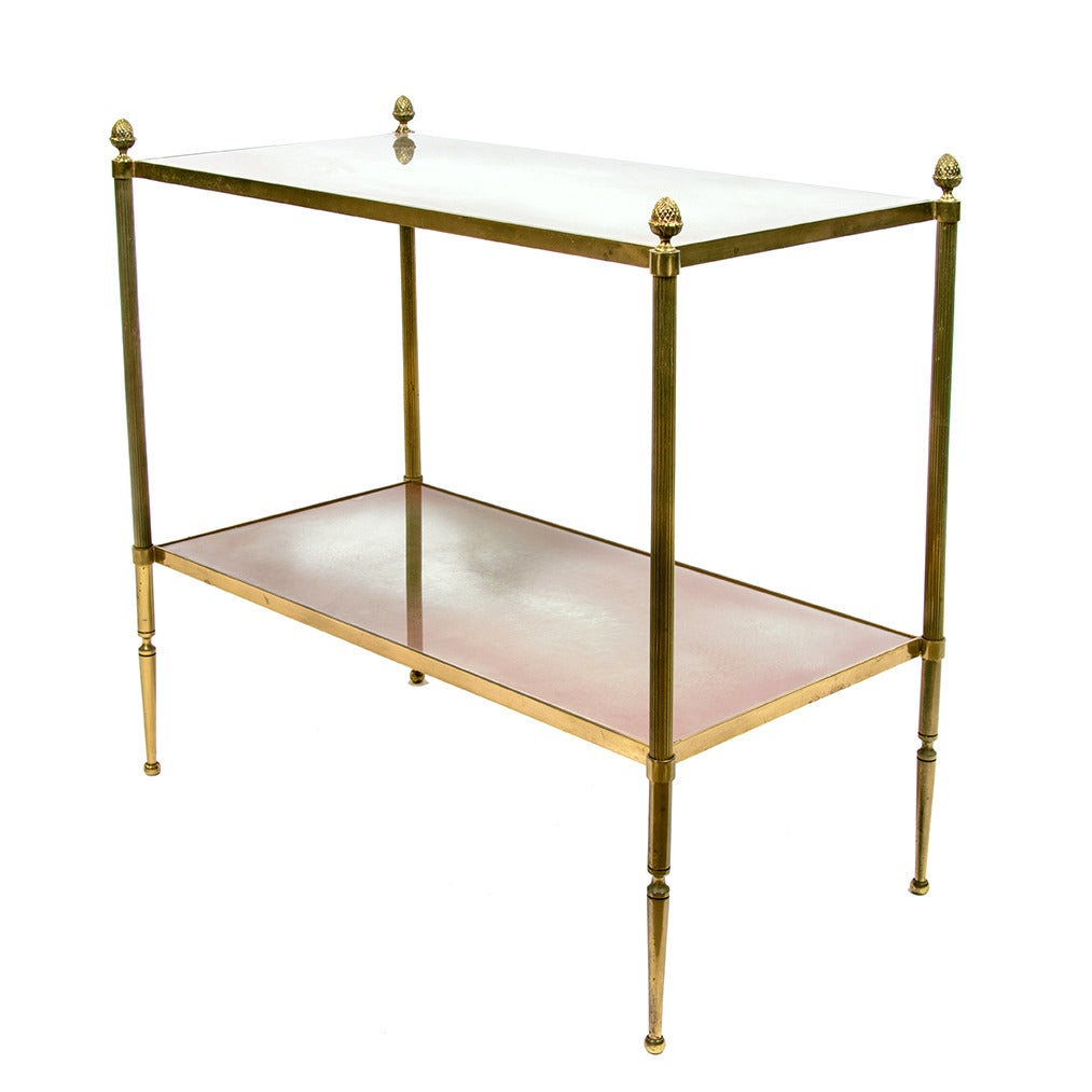 A pair of Baguès style gilt brass side tables with two églomisé mirror trays, pine cone finials.