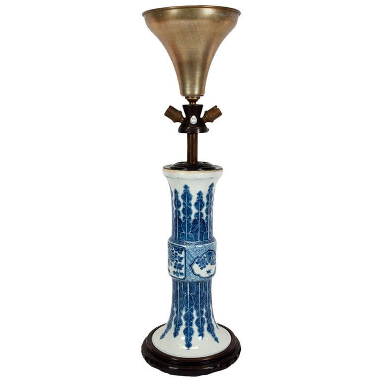 19th century blue and white Chinese porcelain cornet shape vase mounted. Later (mid-20th century) mounted as a lamp on a dark wood base. No shade provided.