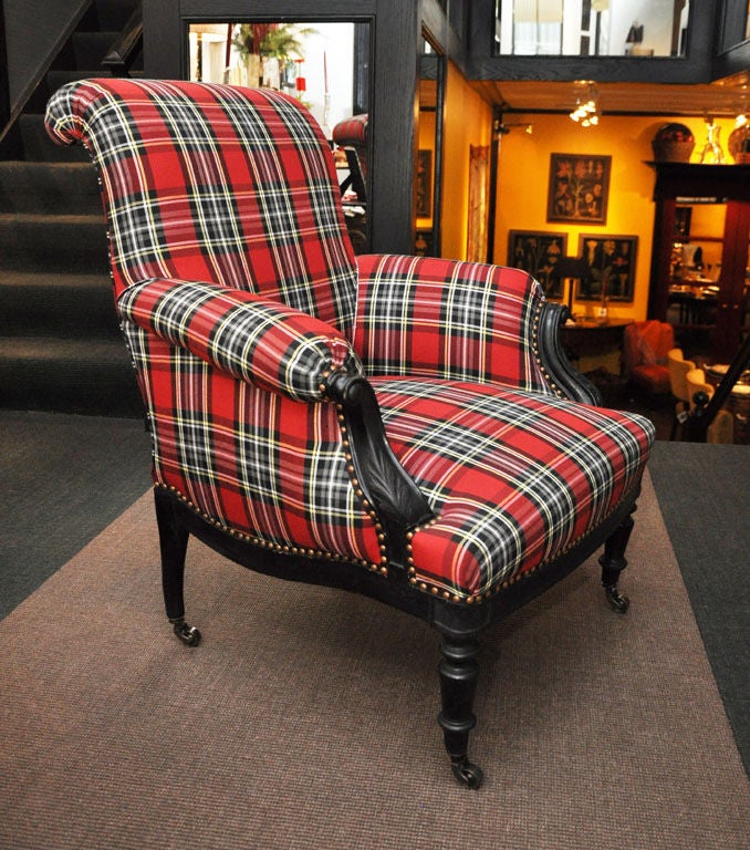 A Pair of Napoleon III Ebonized Bergeres with Red Cotton Tartan Upholstery and Nailhead Trim

Seat Height 15''
Seat Depth 22''