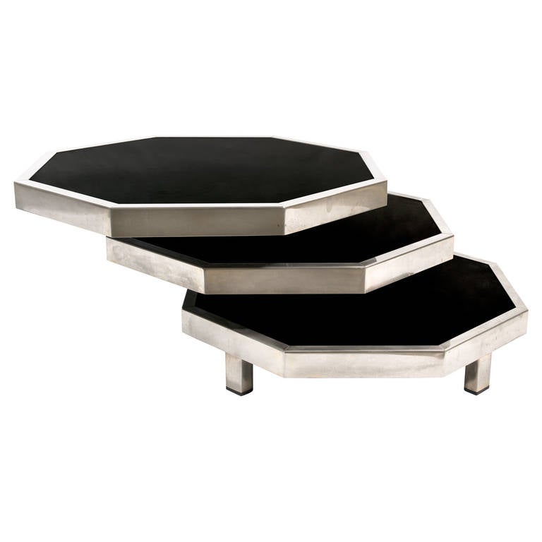 Three-tier swivel black stratified wood and metal octagonal side table in the style of Maria Pergay.
